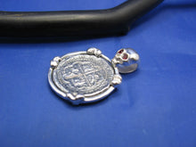 Load image into Gallery viewer, Sterling Silver Pirate Coin Pendant with Reproduction "1 Reale" Treasure Cob with Red Crysta Skull Bail and Bone Prongs