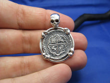 Load image into Gallery viewer, Sterling Silver Pirate Coin Pendant with Reproduction &quot;1 Reale&quot; Treasure Cob with Red Crysta Skull Bail and Bone Prongs
